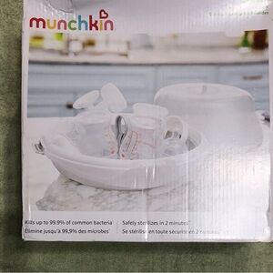 Munchkin steam microwave bottle sterilizer nipple pacifier. 11.30x12.50x6.70”